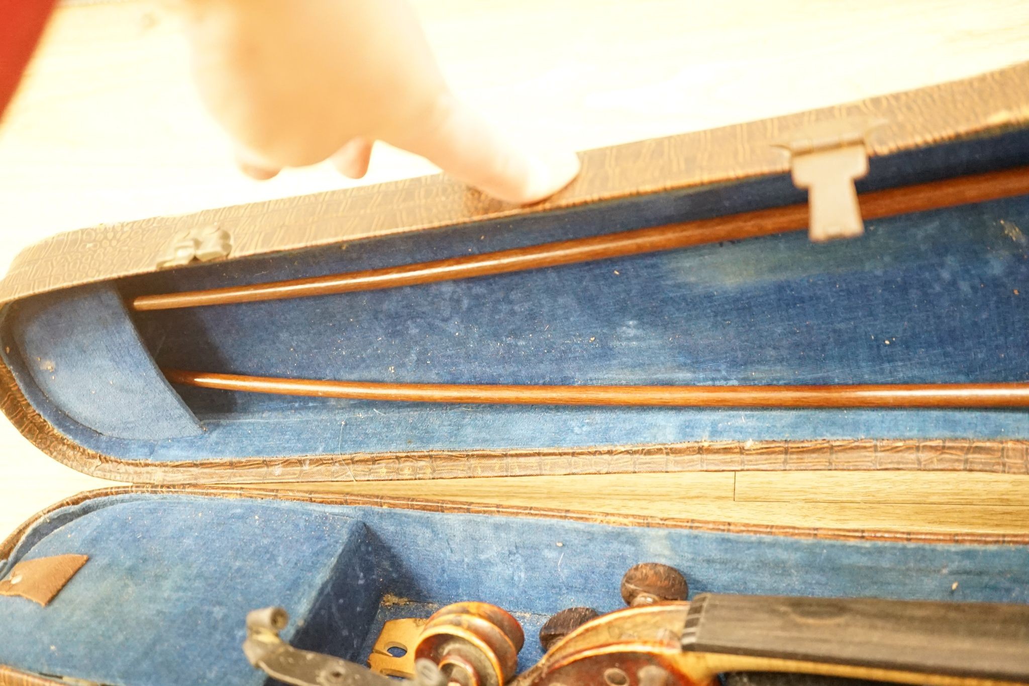 A late 19th century German violin and two bows, cased
